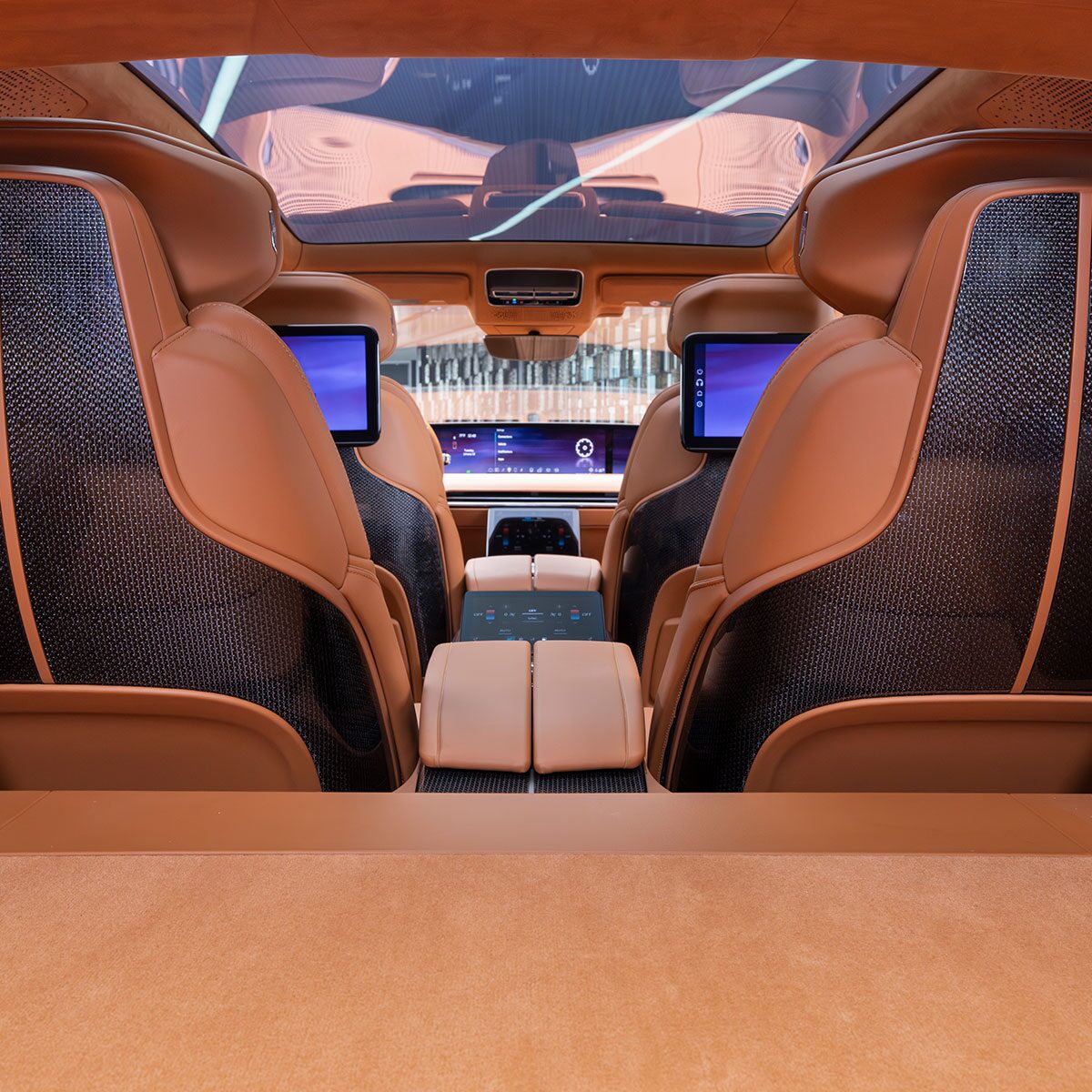 The Cadillac CELESTIQ Car's Rear Interior Features Cream-Colored Seats with Dual Entertainment Screens.