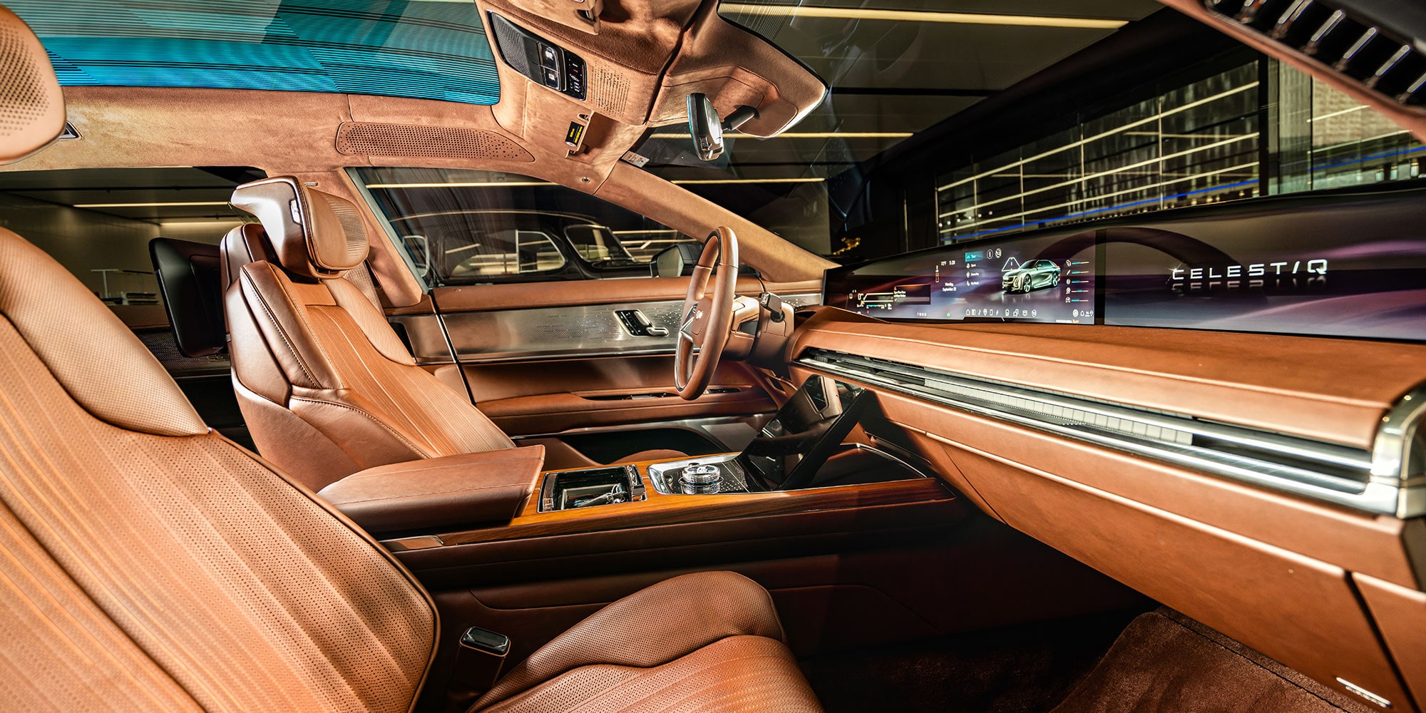 The Interior of the Cadillac CELESTIQ With Rich Brown Wood Trim and Leather Seats, Showing the Dashboard and Wide Screen.