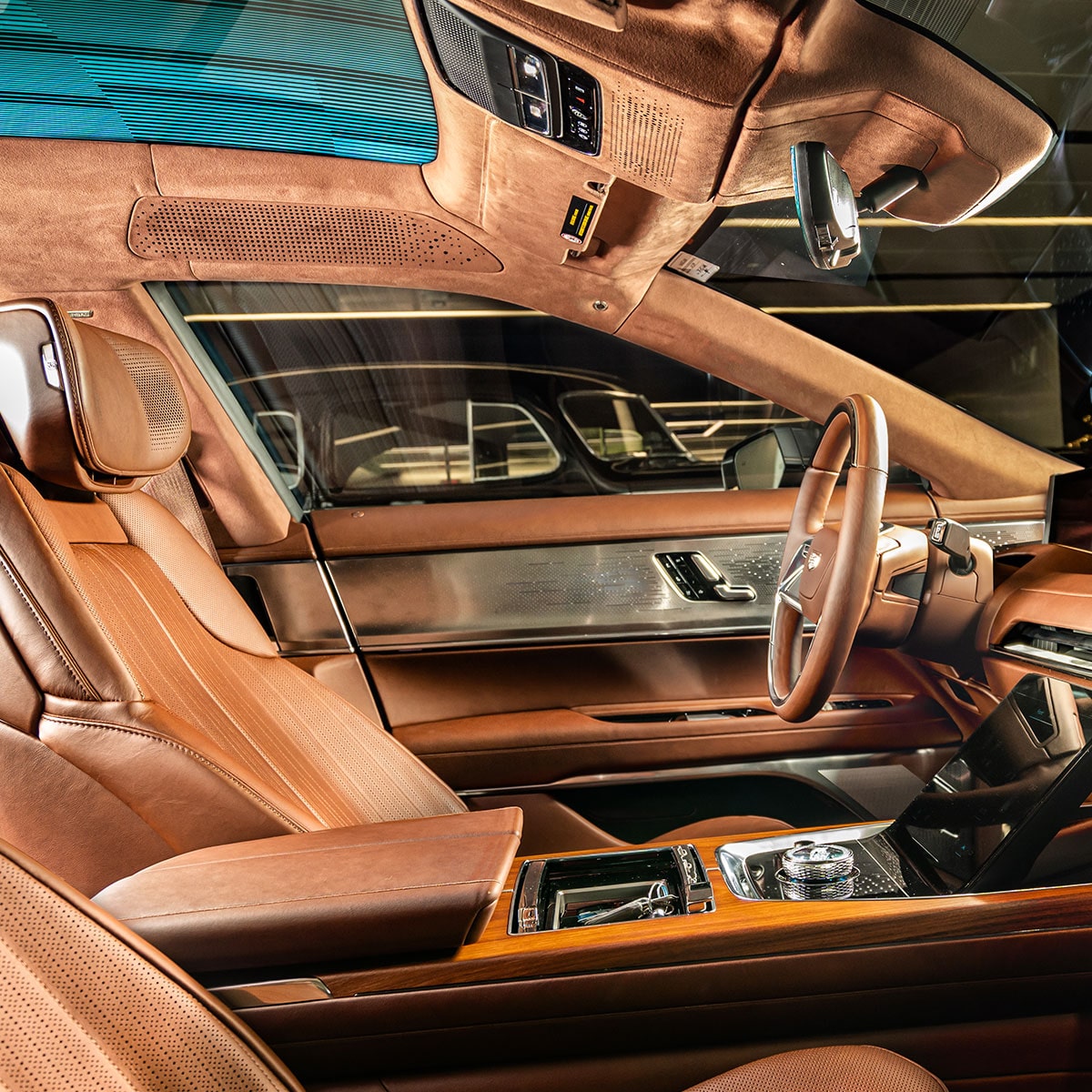 The Interior of the Cadillac CELESTIQ, Highlighting Brown Leather, Wood Trim, Dashboard, and Steering Wheel.