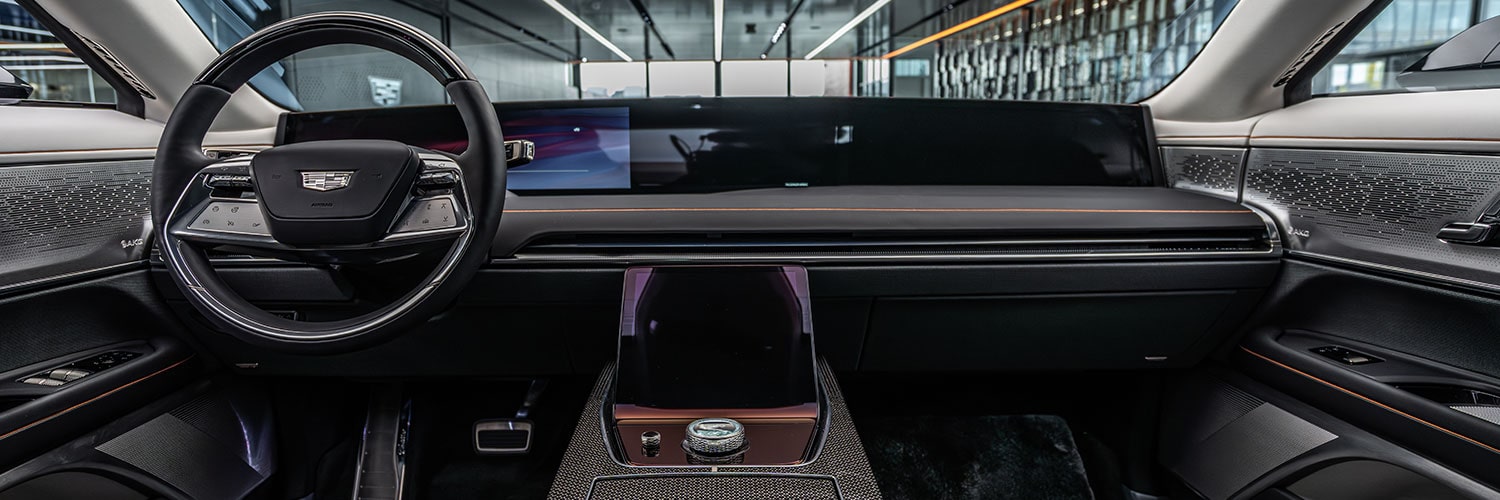 The Luxurious Red Leather Interior of a Cadillac CELESTIQ, Showing the Front Seats and Center Console.