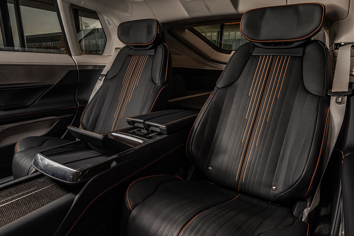 A Close-up View of the Red Leather Steering Wheel of the Cadillac CELESTIQ, with the Cadillac Logo and Digital Dashboard Visible.