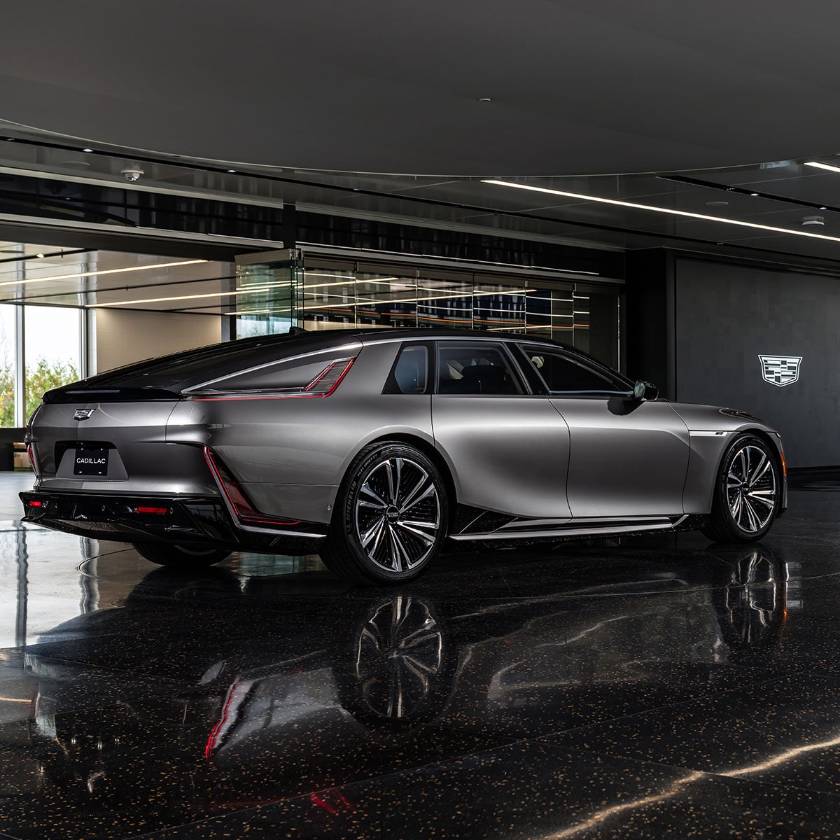 The Rear View of a Cadillac CELESTIQ Interior with Red Leather Seats and Multiple Entertainment Screens.