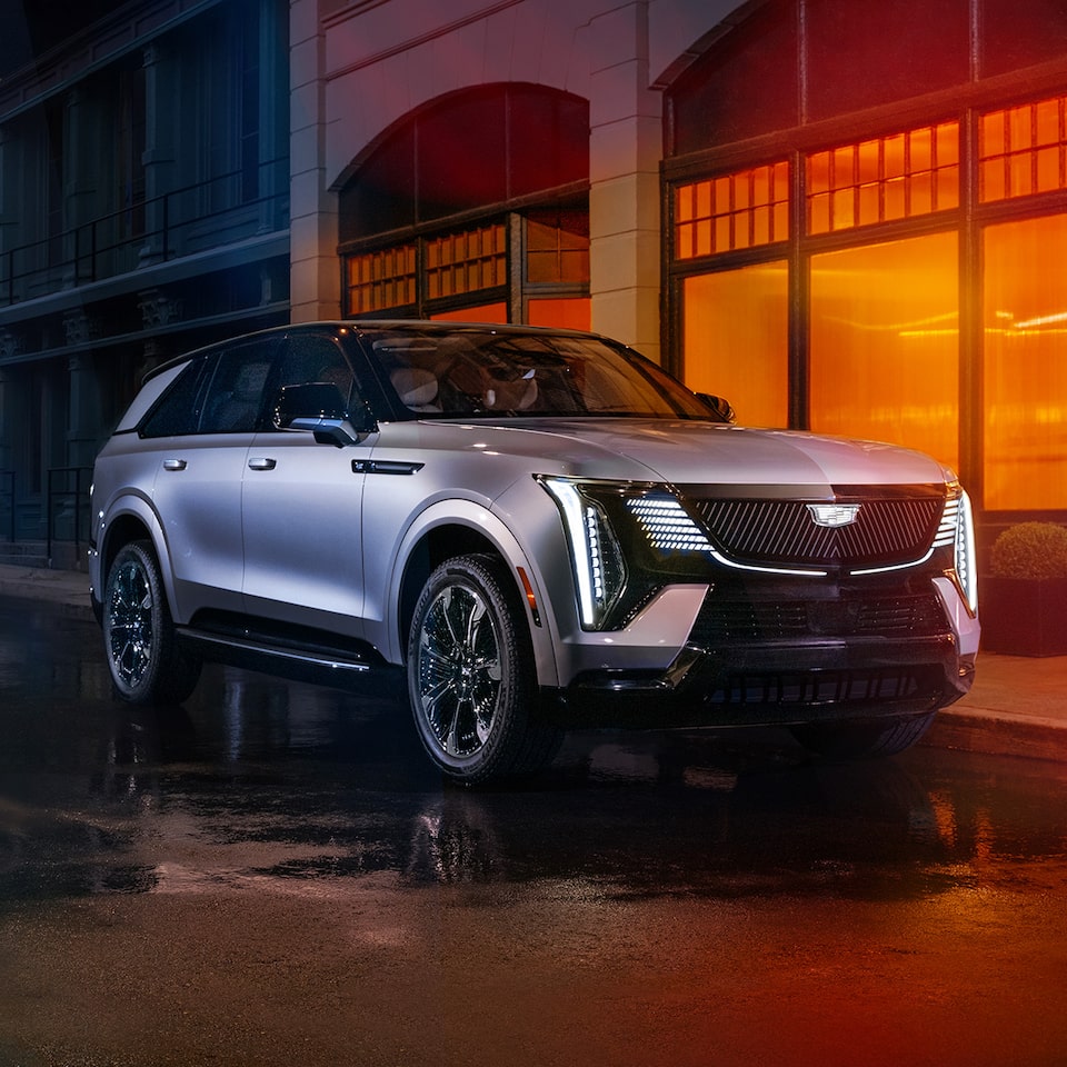 2025 Cadillac Escalade IQ Parked Outside a Restaurant at Night