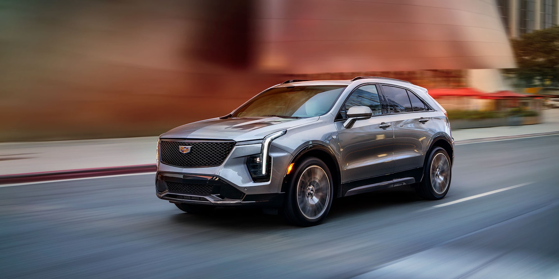 2025 XT-4 SUV 4 Cylinder 2.0 Liter Turbo Engine driving down highway