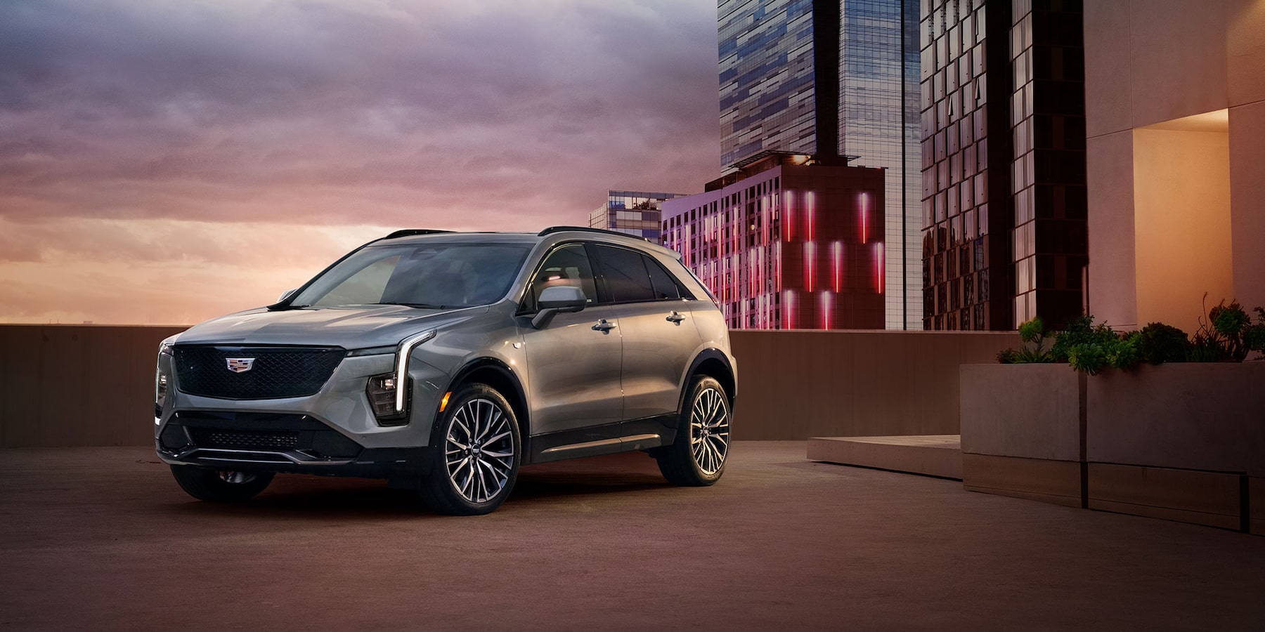 2025 Cadillac XT-4 in silver parked on parking garage roof