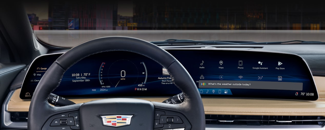 Driver's Seat View of the 2025 Cadillac XT4 Sleek Dashboard Outlooking the City