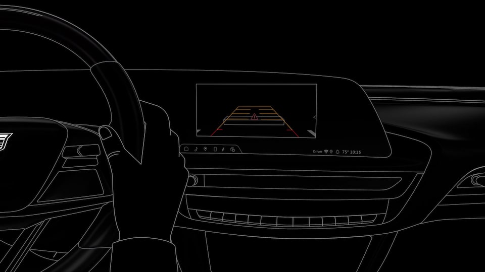 A Person Using the Rear View Mirror Camera Safety Feature in the 2025 Cadillac XT6