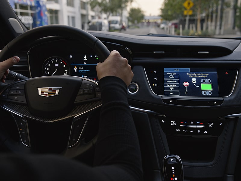 A Man Uses the Automatic Parking Assist Technology of the 2025 Cadillac XT5