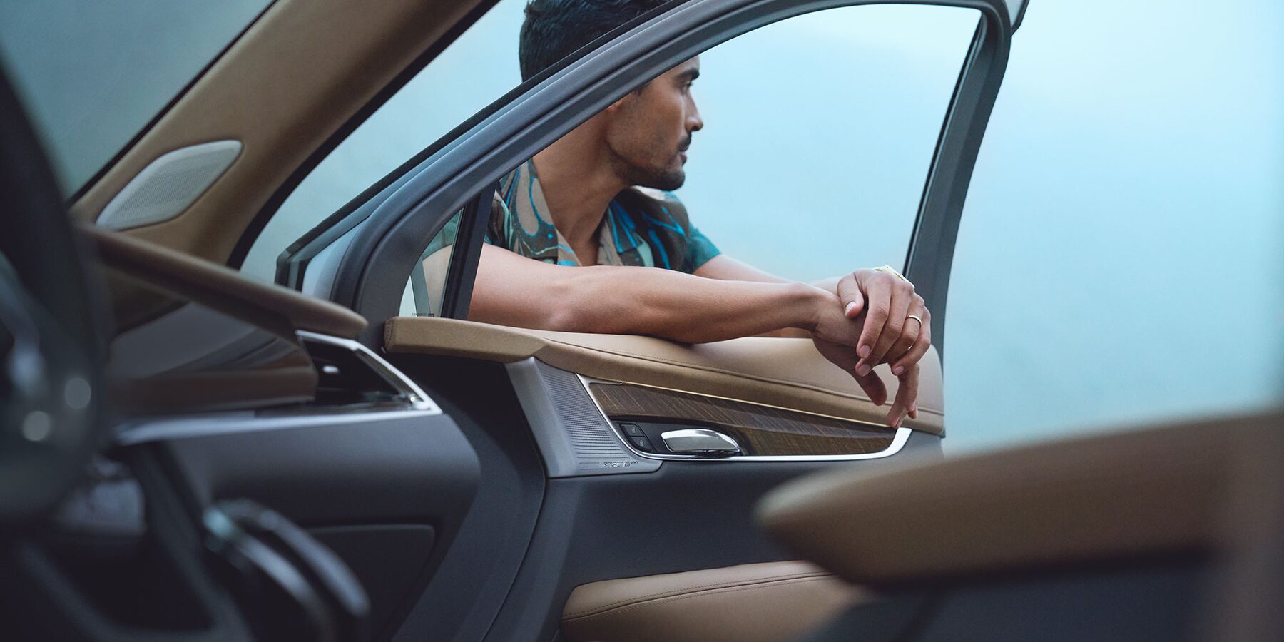 2025 Cadillac XT6 with window down and man standing in window