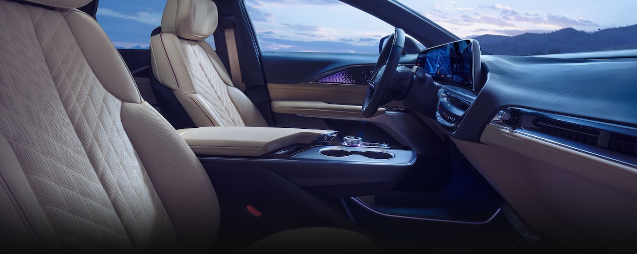 Passenger Seat View of the 2025 Cadillac LYRIQ Front Row Cabin Outlooking the Mountains