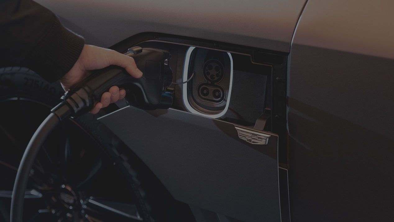 Close-up of Someone Inserting an EV Charger into the Cadillac LYRIQ Charging Port