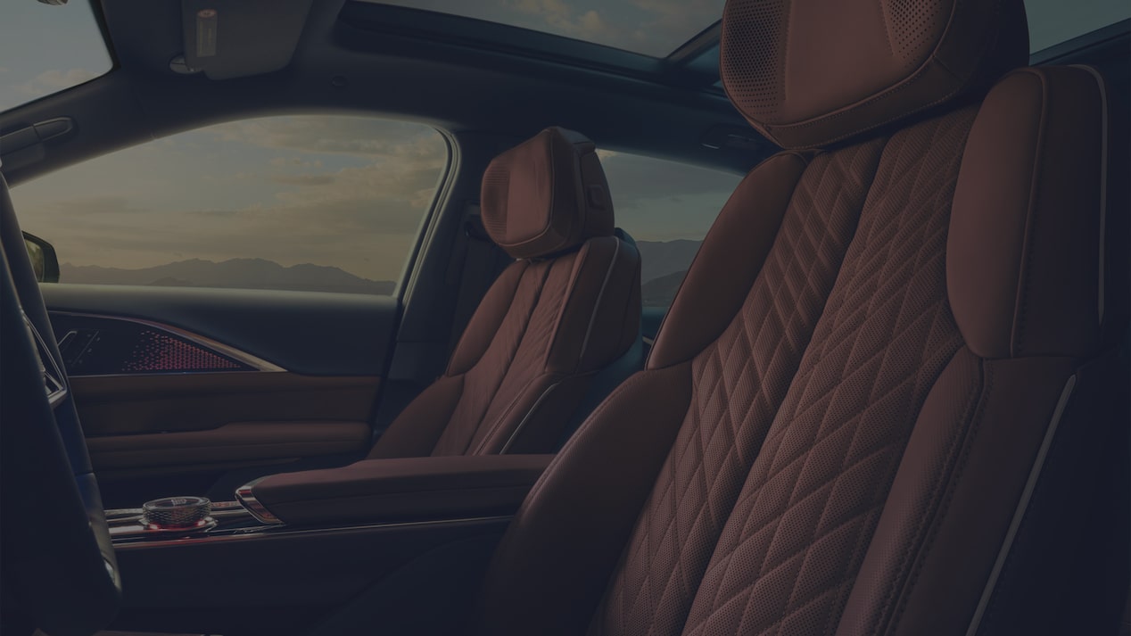 2027 Cadillac LYRIQ Front Seats With Quilted Leather Upholstery and a Panoramic Glass Roof.