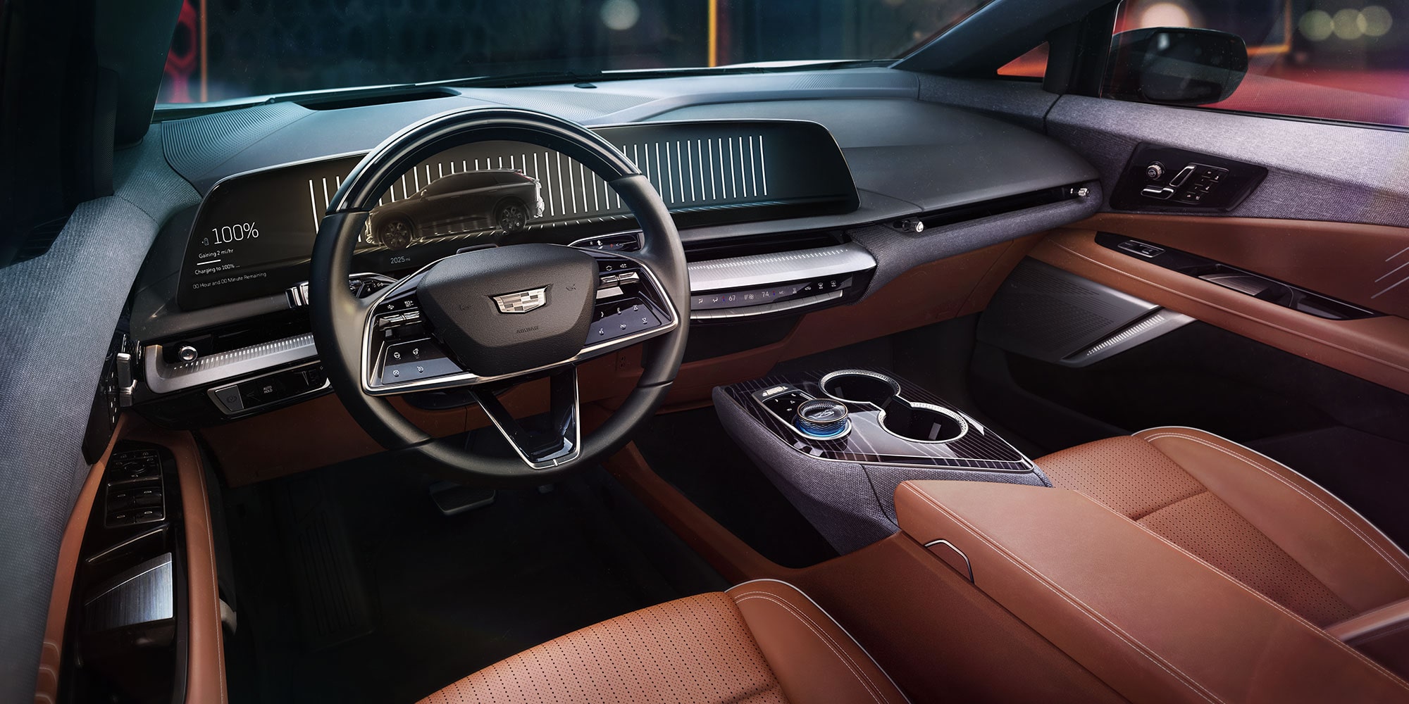 2025 Cadillac OPTIQ brown interior with large infotainment center screen.