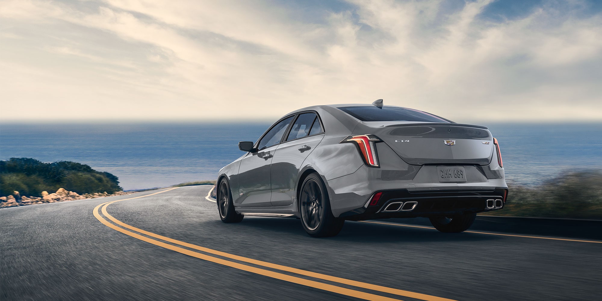 Grey 2025 Cadillac CT-5 V driving towards the shore