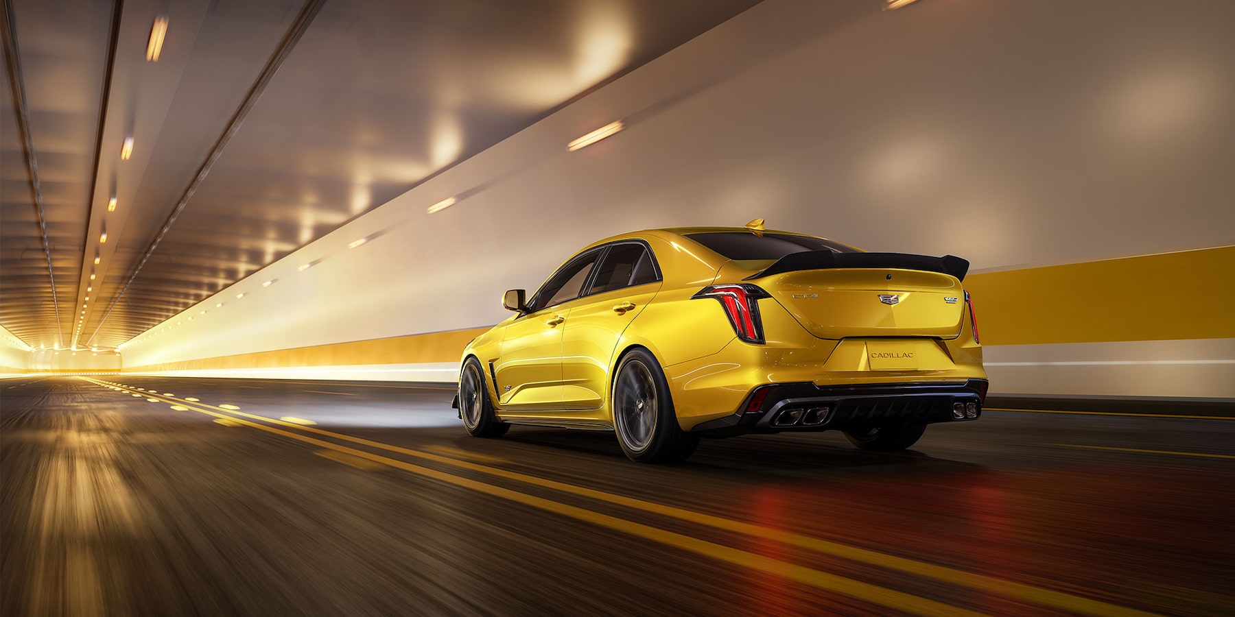 rear view of 2025 Cadillac CT4-V driving through underground tunnel.