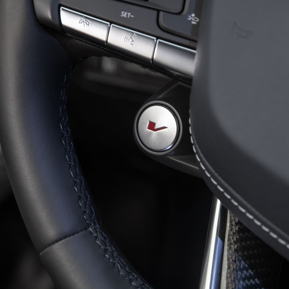 Close-up of the V Button on the 2025 CT4-V Steering Wheel
