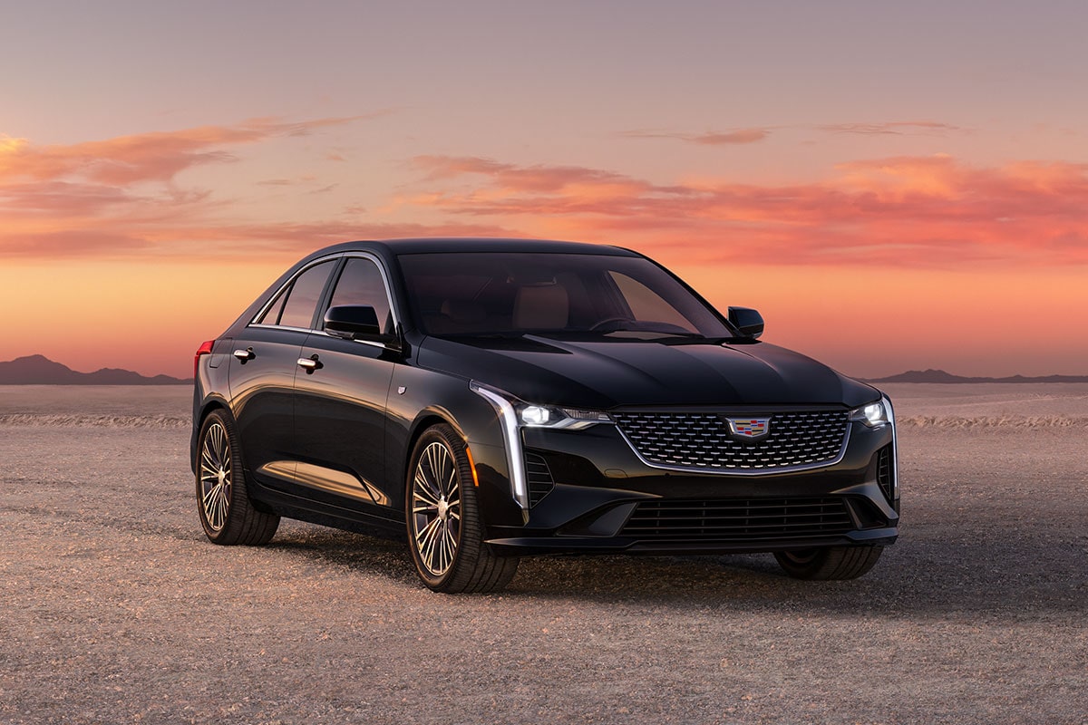 Three Quarters Front View of a Black 2025 CT4 Parked in the Open Desert