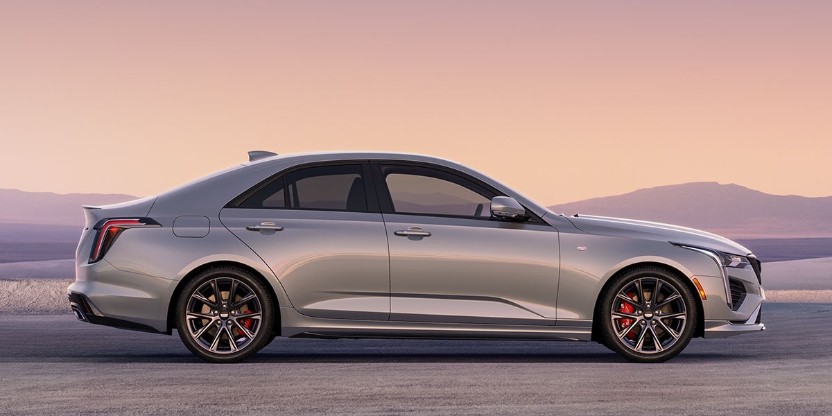 Side Profile View of a Silver 2025 CT4 Parked in the Open Desert