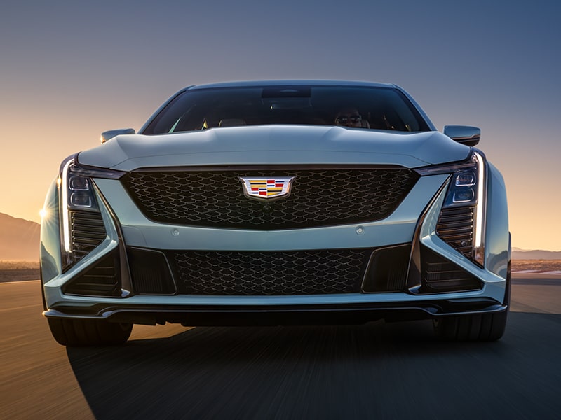 Low Front View of a Light Blue 2025 Cadillac CT5-V Driving Down the Road