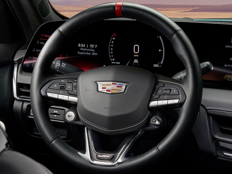 Close-up Driver's Seat View of the Black Steering Wheel in a 2025 Cadillac CT5-V