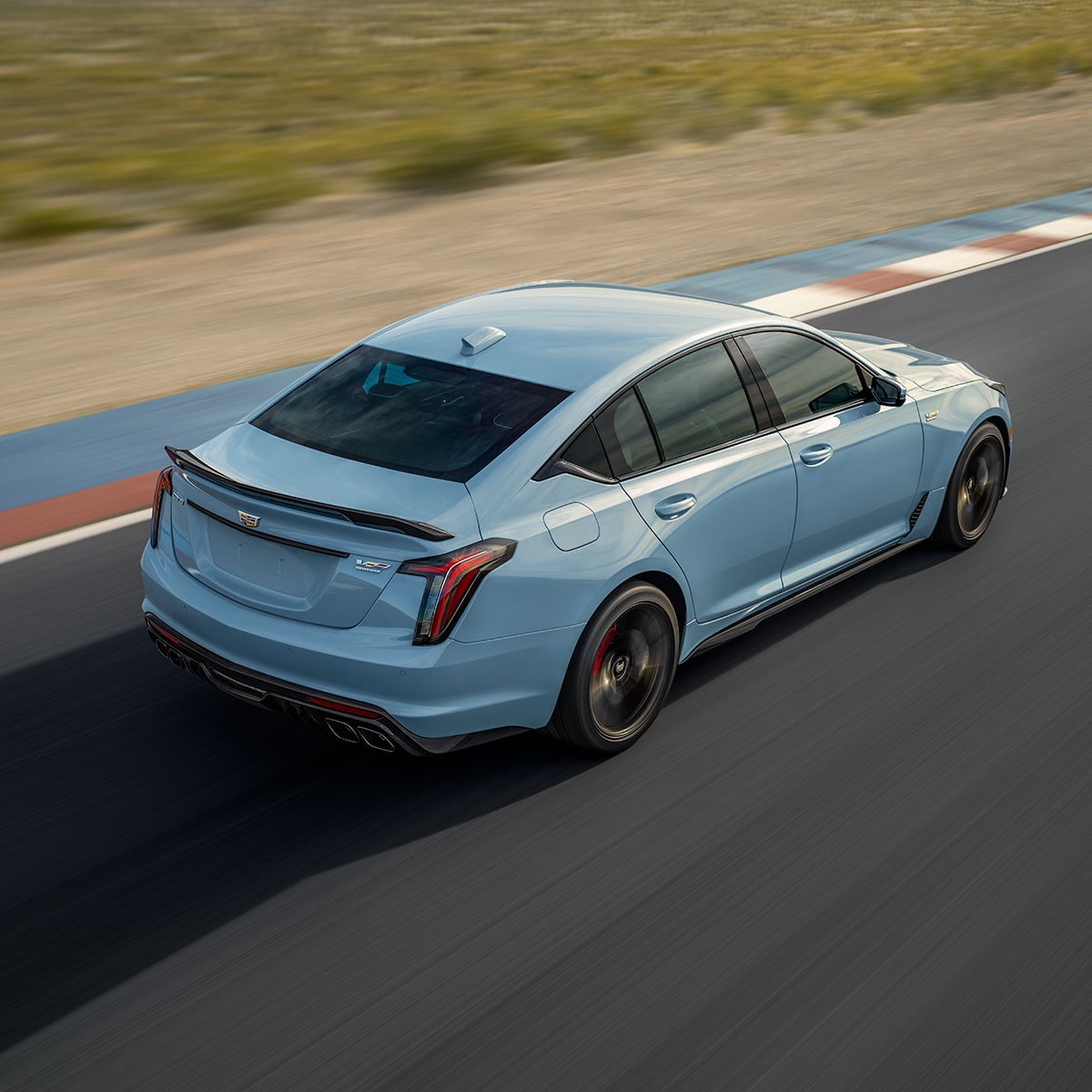 Overhead View of a 2025 Cadillac CT5-V Driving Down the Road Next to a Desert
