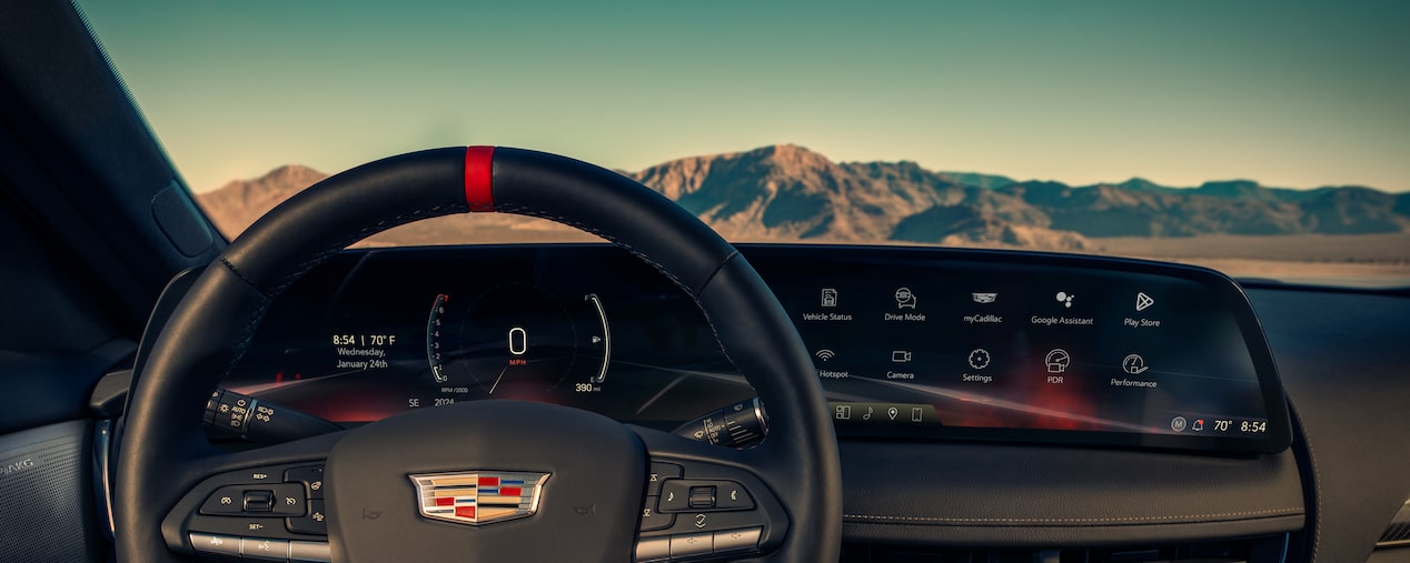 Driver's Seat View of a 2025 Cadillac CT5-V Steering Wheel in Front of Mountains
