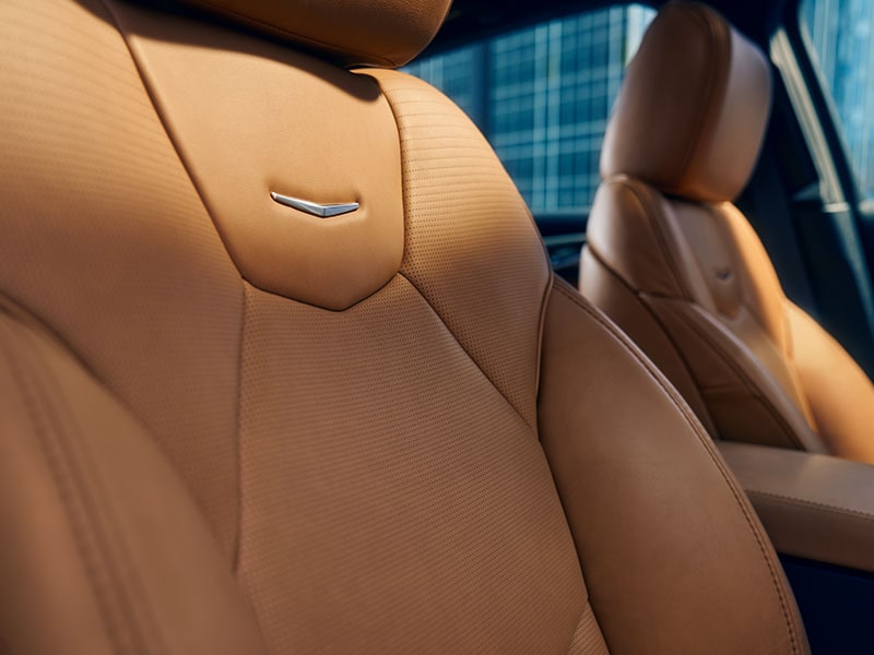 Sun Shining on 2025 Cadillac CT5 Crest on Front Leather Seats
