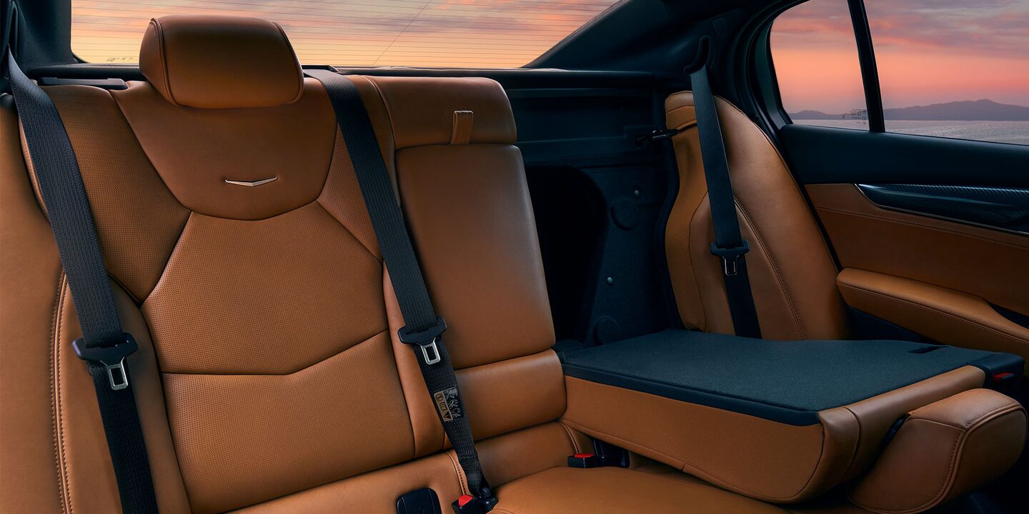 Brown leather interior backseat with driver side back seat folded down