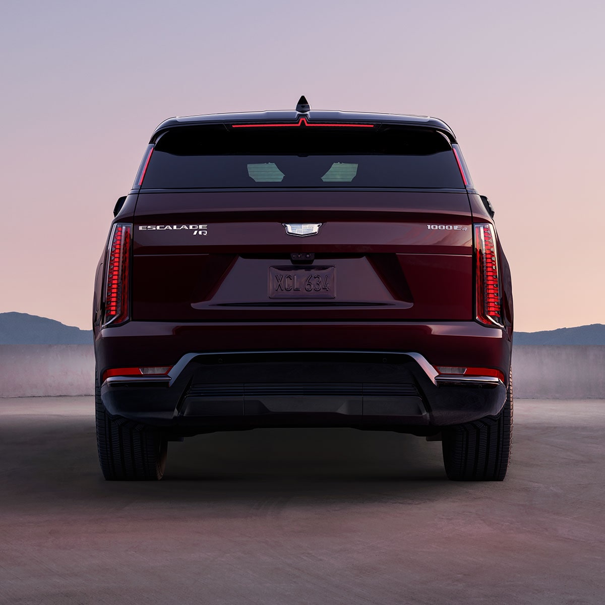 Rear End View of the 2026 ESCALADE IQ Parked in the Desert During Dusk