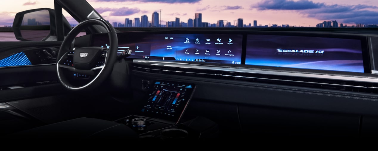 Passenger View of a Man Driving the 2026 ESCALADE IQL Large Electric SUV in the Desert