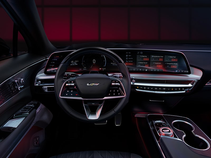 Driver Seat View of the 2026 LYRIQ-V Interior and Dashboard with a Red Accent Lighting