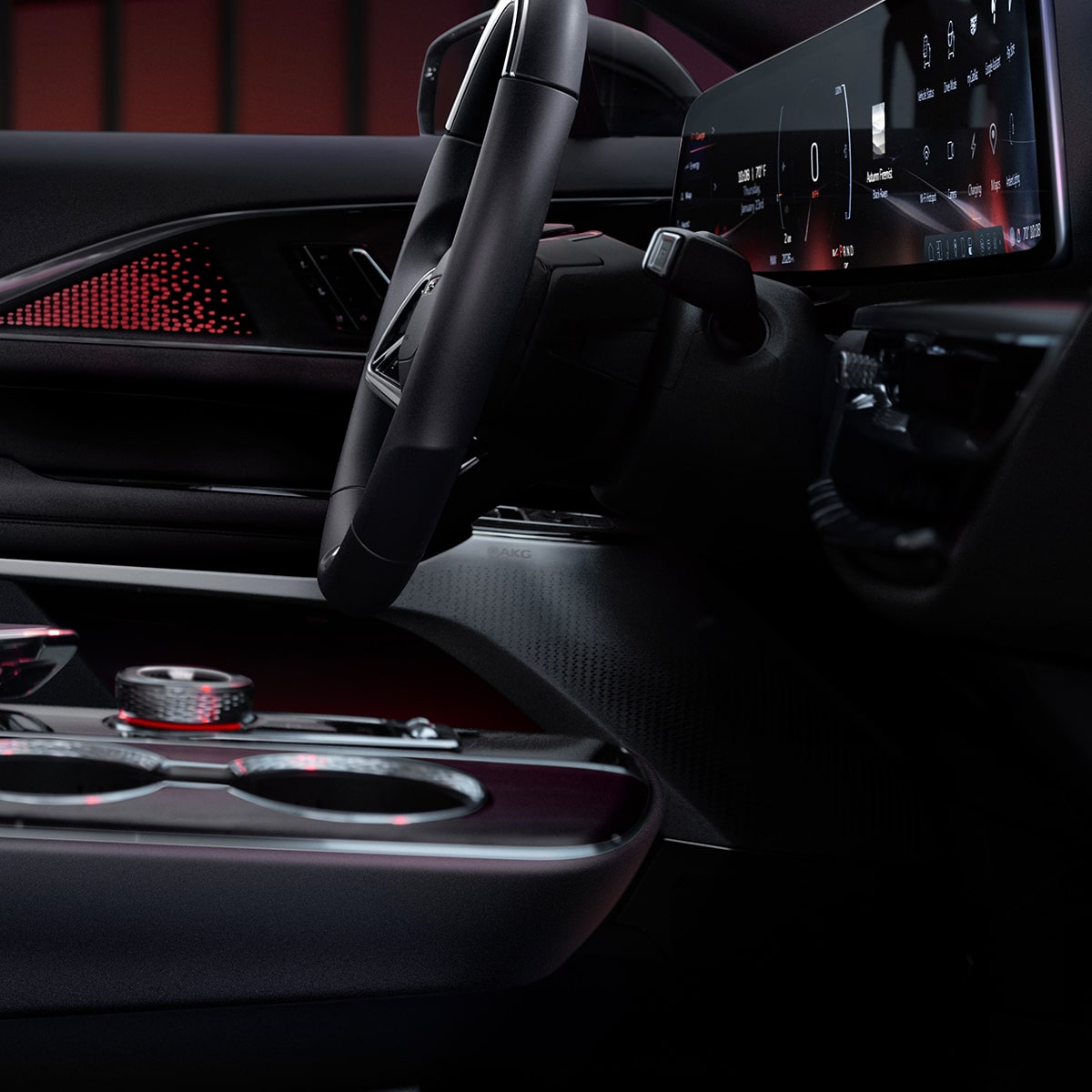 Close-up of the 2026 LYRIQ-V Steering Wheel and AKG Speakers in Driver's Door