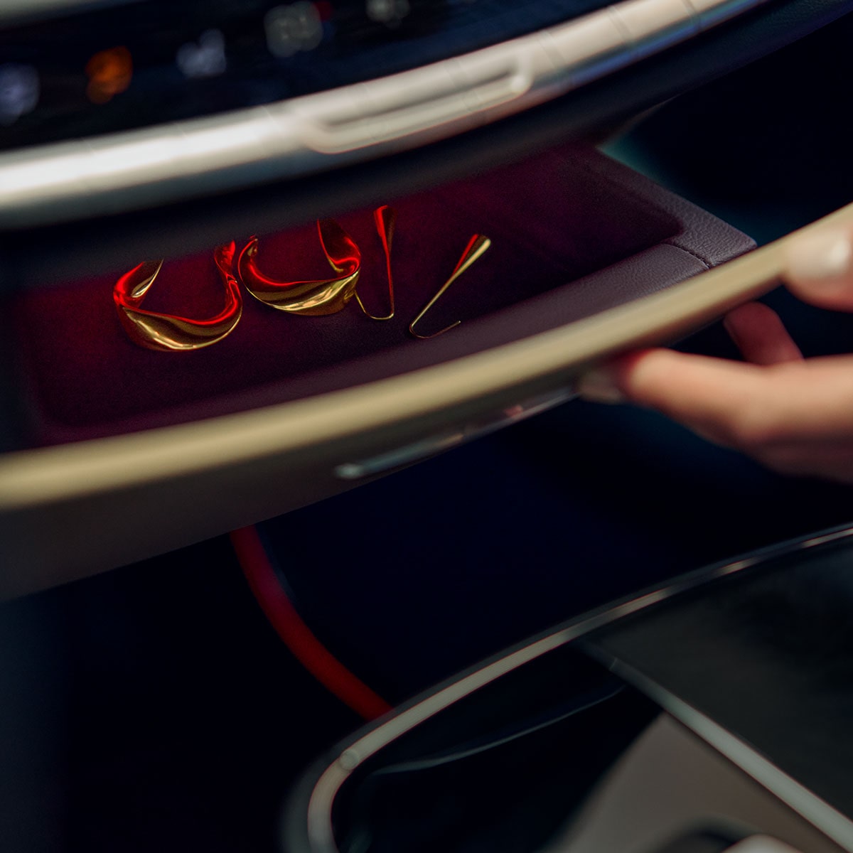 Close-up of Jewelry Inside of the Cadillac LYRIQ's Dashboard's Storage Drawer