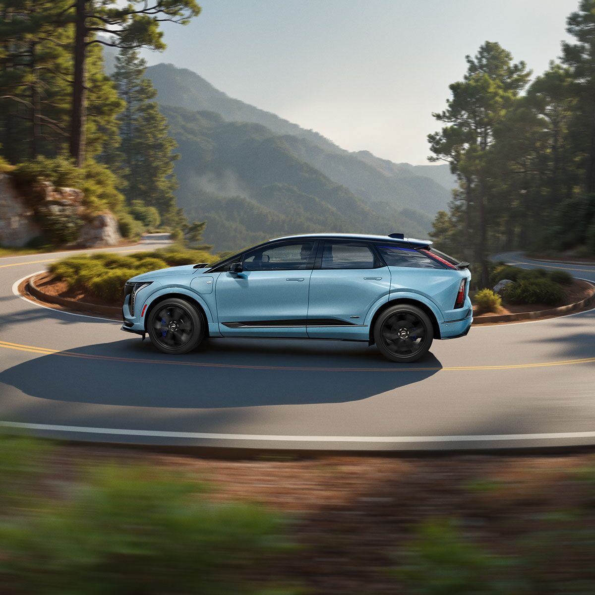 Three-quarters Passenger Side View of a Parked Blue 2026 OPTIQ-V