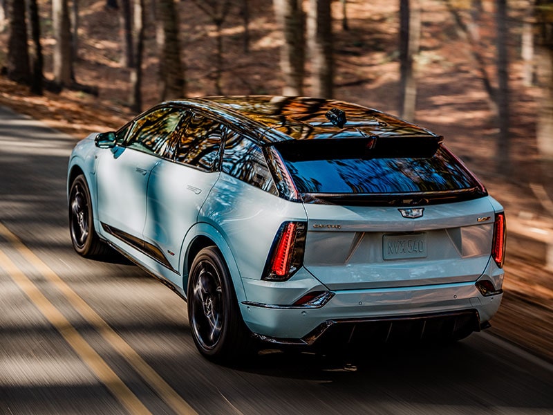 Close-up of the V-Series Logo on the Rear End of Blue 2026 OPTIQ-V