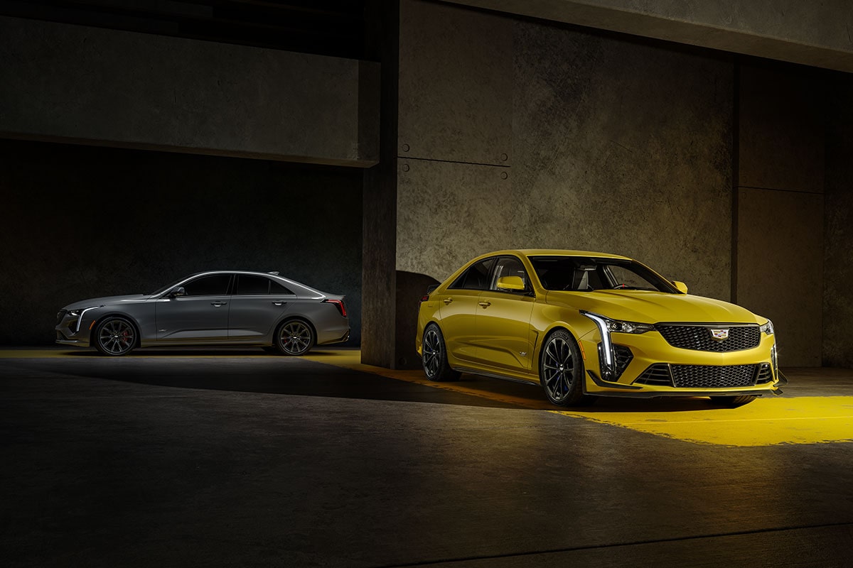 A Silver 2026 CT4-V and a Yellow 2026 CT4-V Blackwing Parked in a Parking Garage