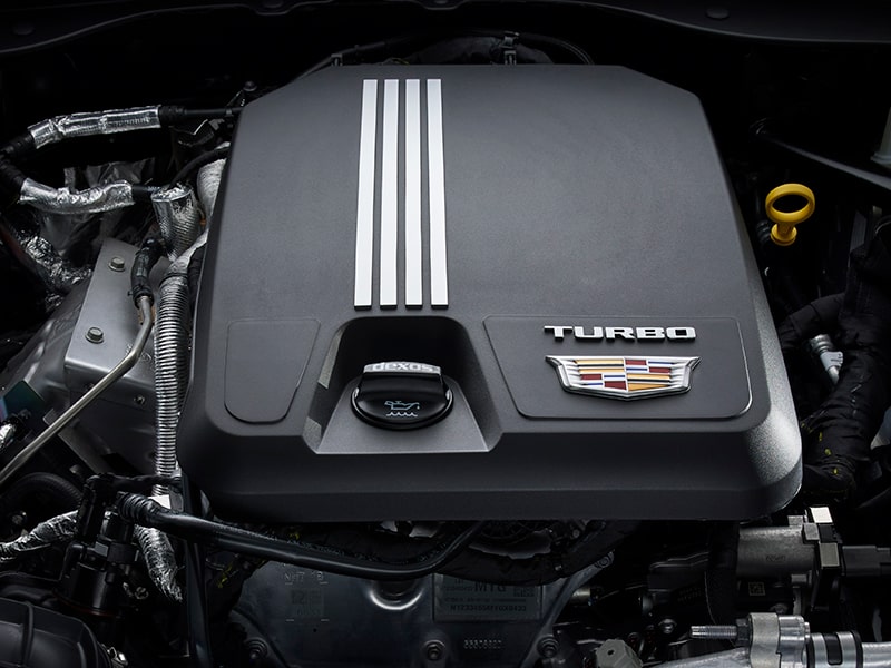 The 2026 Cadillac CT5 Steering Wheel and View of 33" Display Screen Outlooking Industrial Buildings