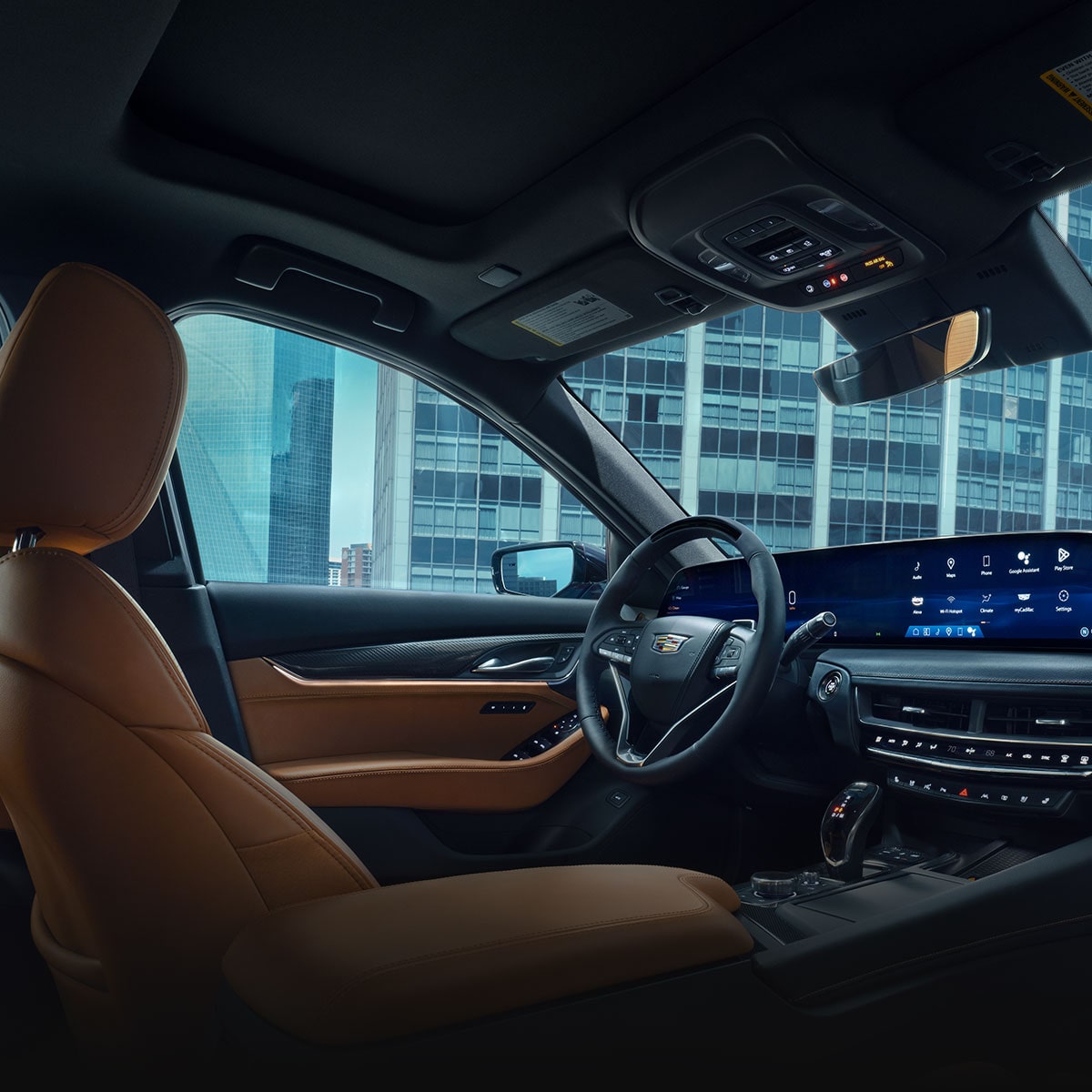 Driver's Side of 2026 Cadillac CT5 Tan and Jet Black Accent Interior Outlooking Industrial Buildingfpo