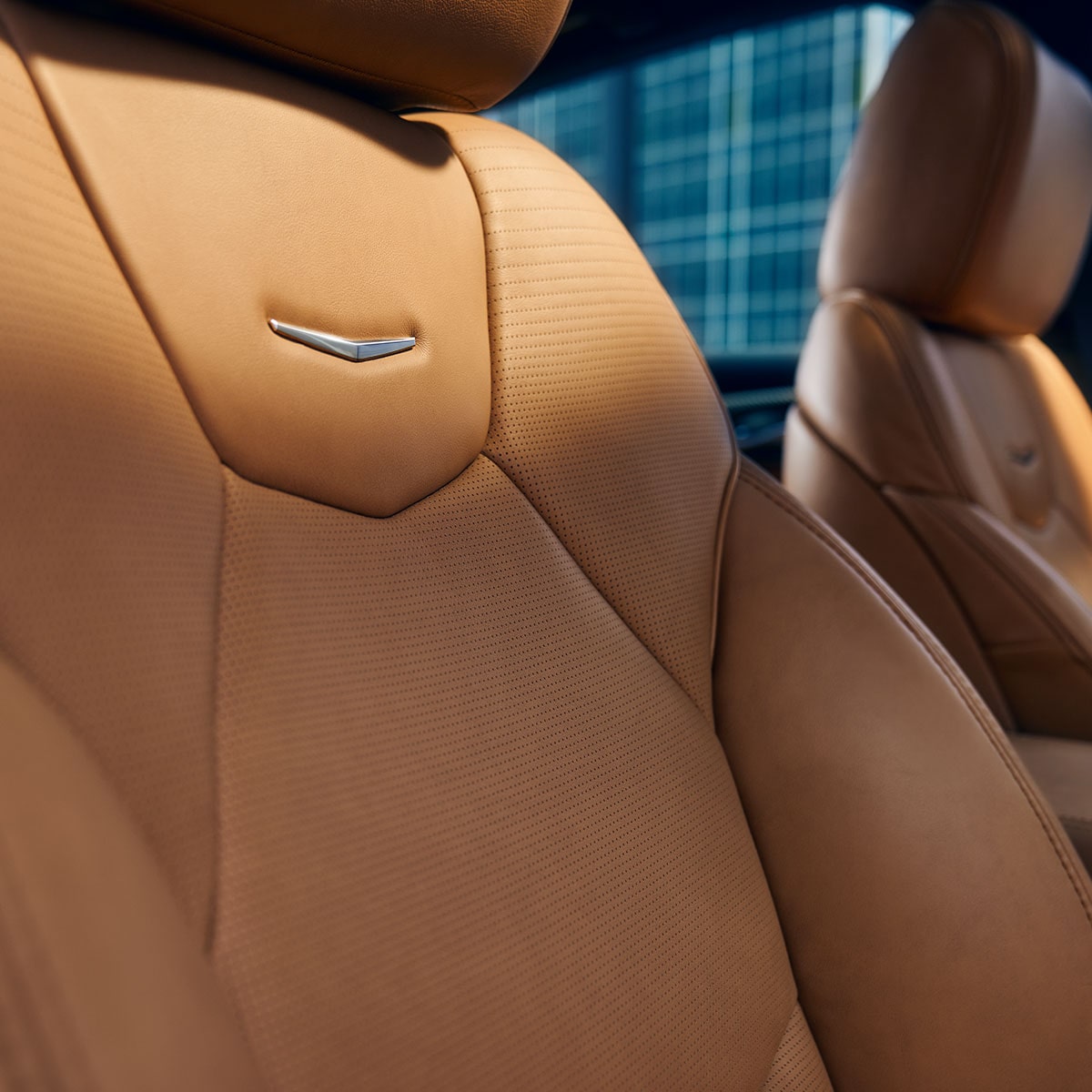 Sun Shining on 2026 Cadillac CT5 Crest on Front Leather Seats
