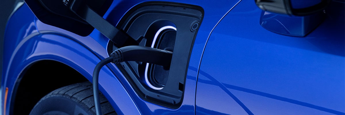 Close-up of a Charger in the EV Port of a Blue OPTIQ-V
