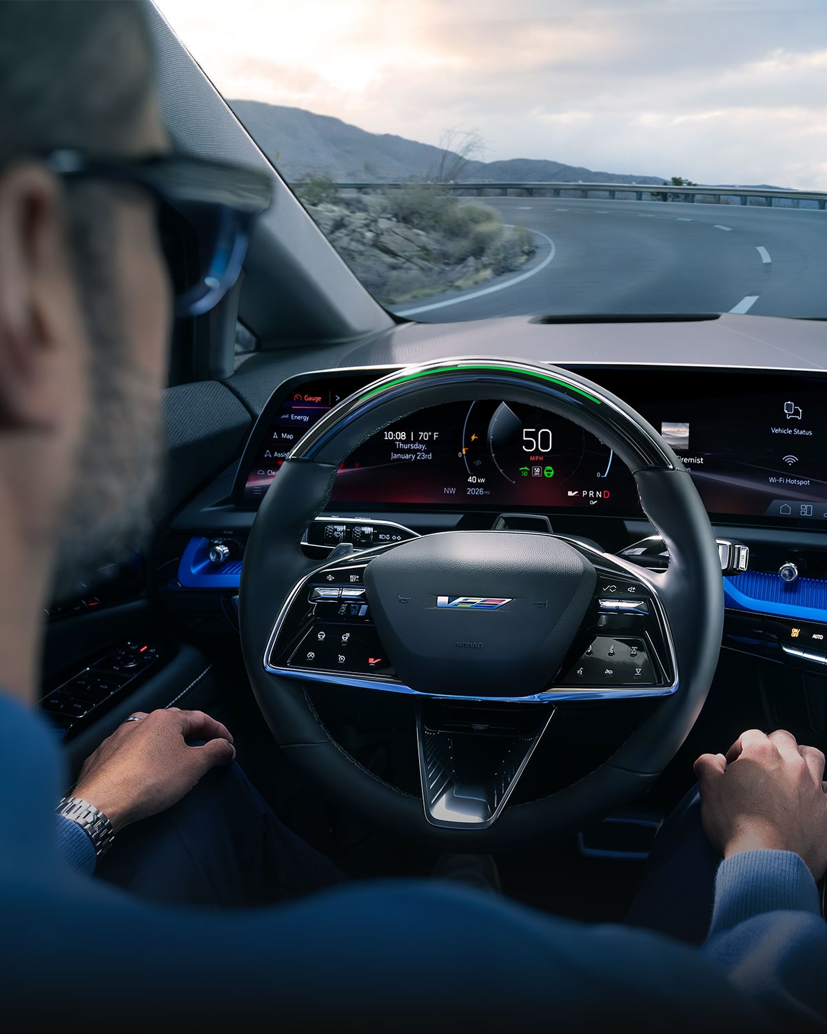 A Driver Utilizing the Super-cruise Hands-free Technology on the Curve of a Mountain Road