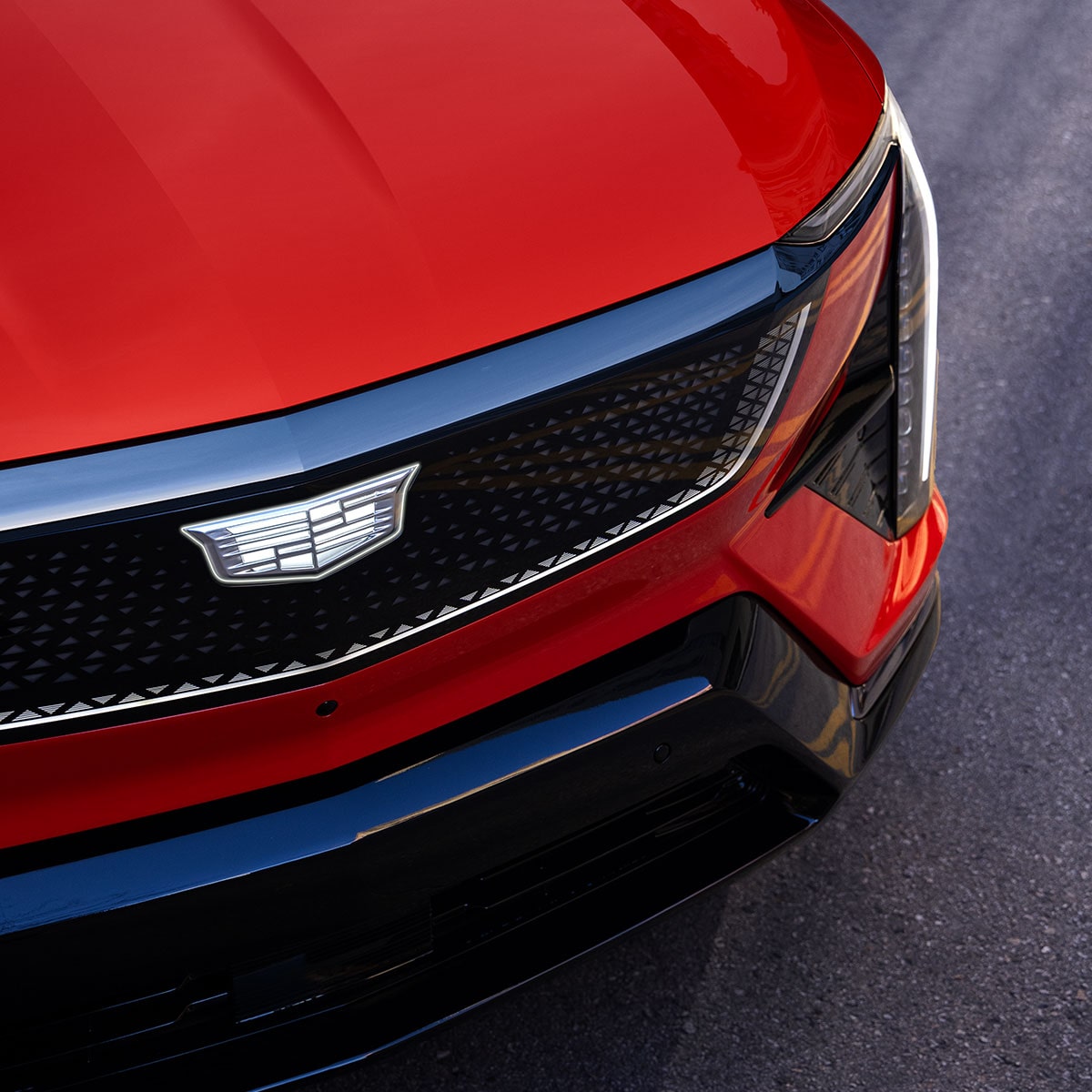 Close-up of the Cadillac Crest Emblem on the Cadillac OPTIQ's Grille