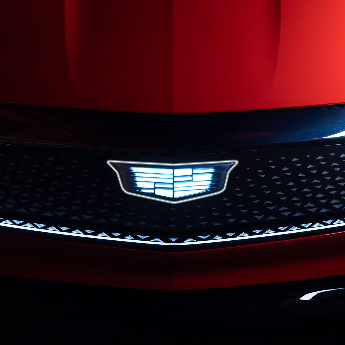 Close-up View of Cadillac Emblem Illuminated on the 2027 OPTIQ Grille