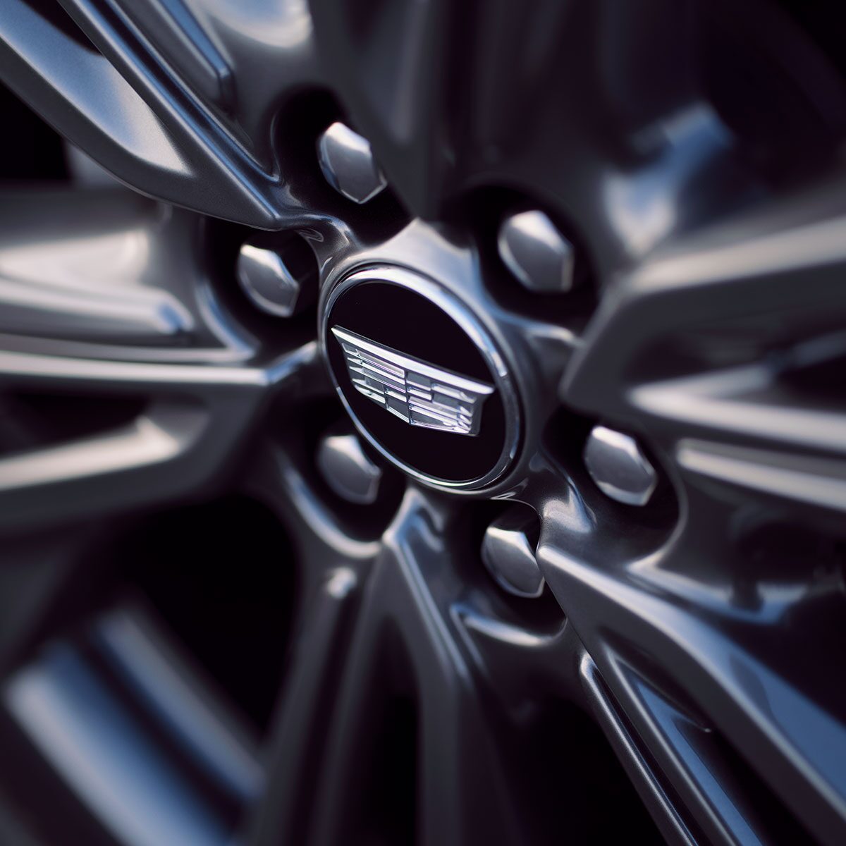 Close-up View of the 2027 OPTIQ's Wheel and Cadillac Logo in the Center of it
