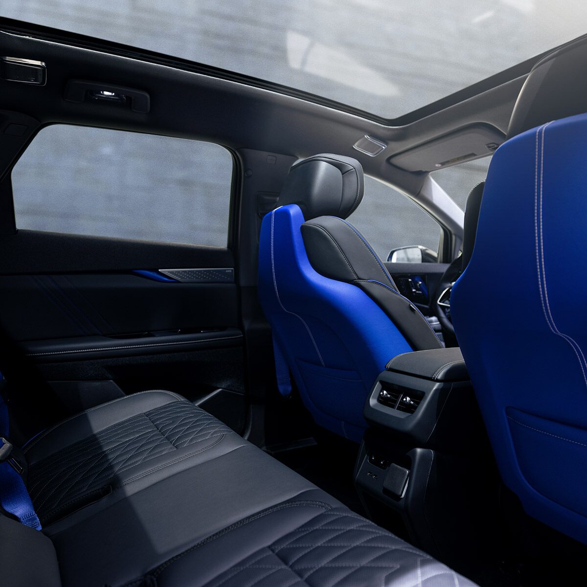 Back Row View of the 2027 OPTIQ-V's Interior, Sun Roof, and Blue Accent Seating