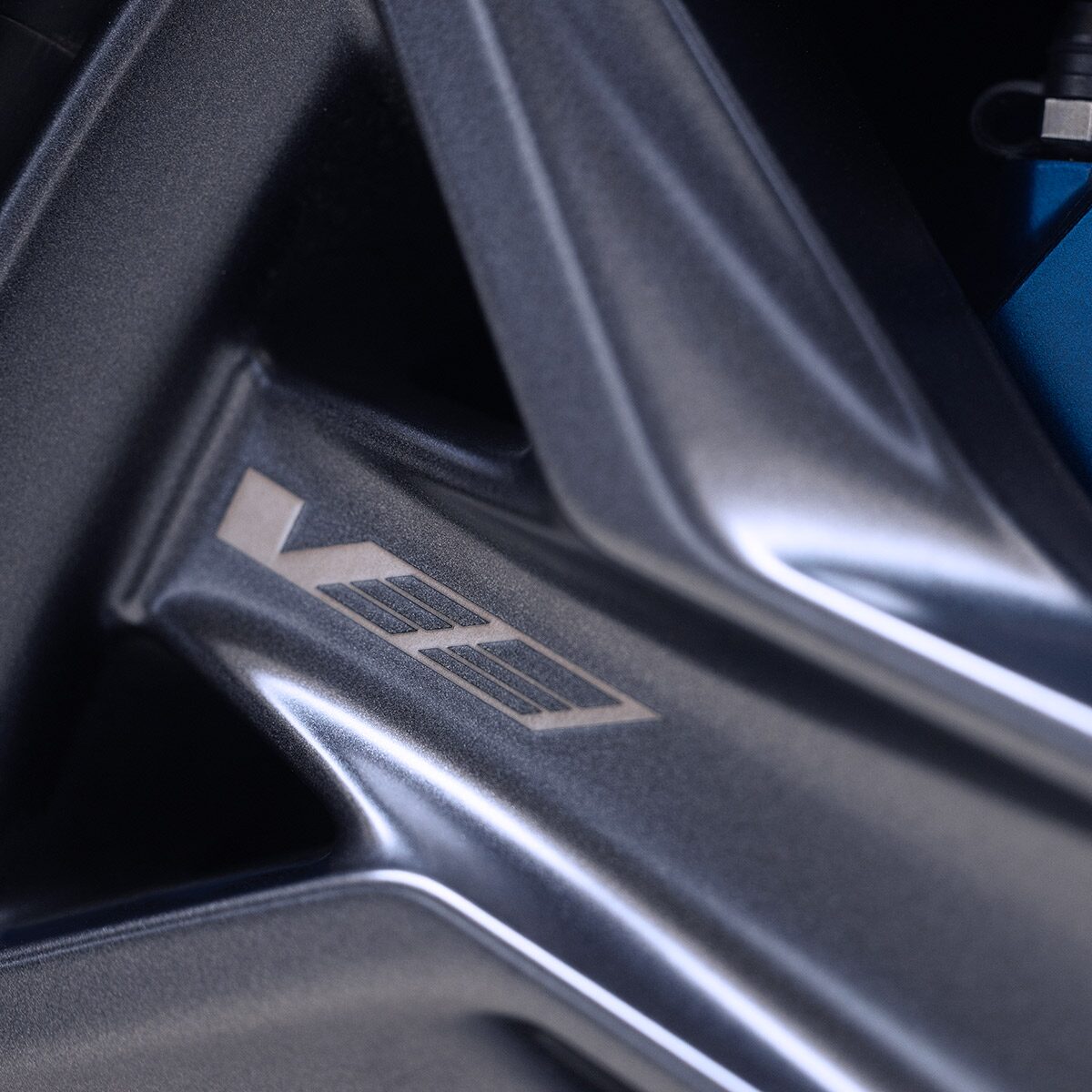 Close-up of the V-Series Logo on the OPTIQ-V Wheel