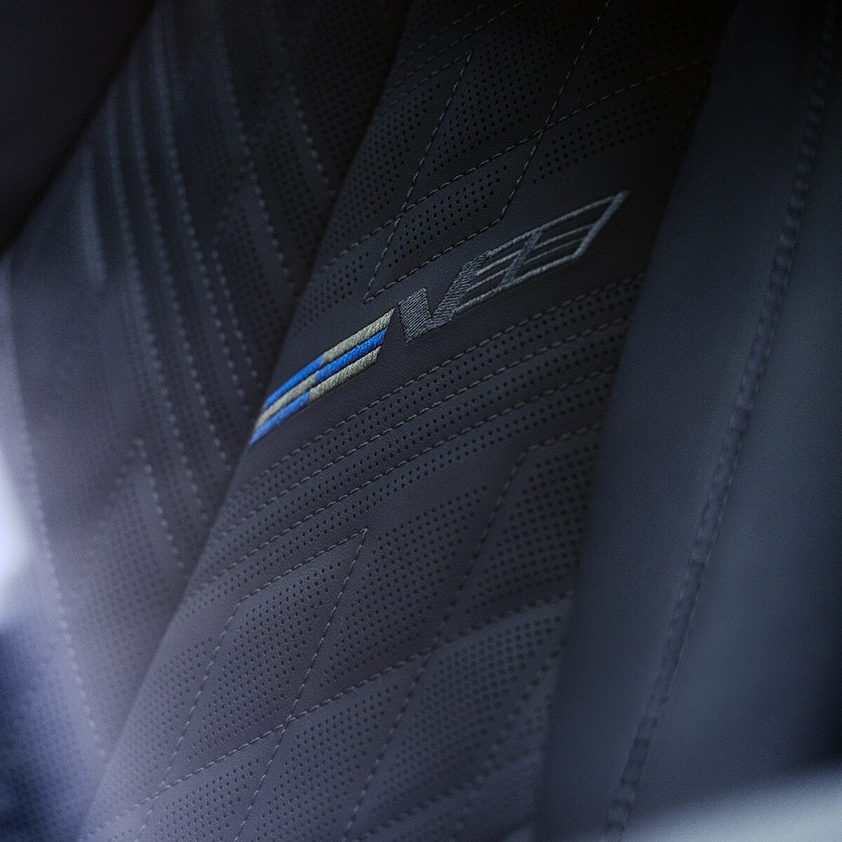 Close-up of the V-Series Badging on the 2027 OPTIQ-V Seat