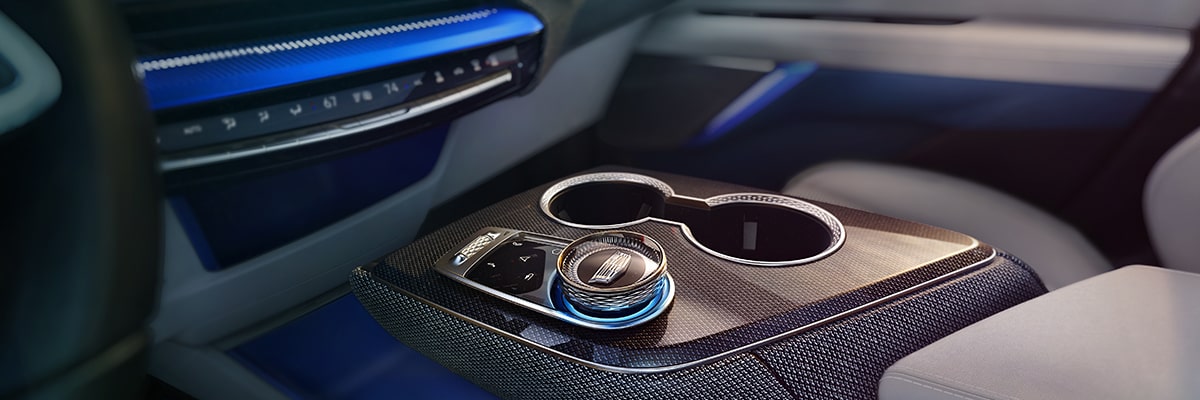 Close-up of the Gear Knob and Cup Holders in the Cadillac OPTIQ's Center Console