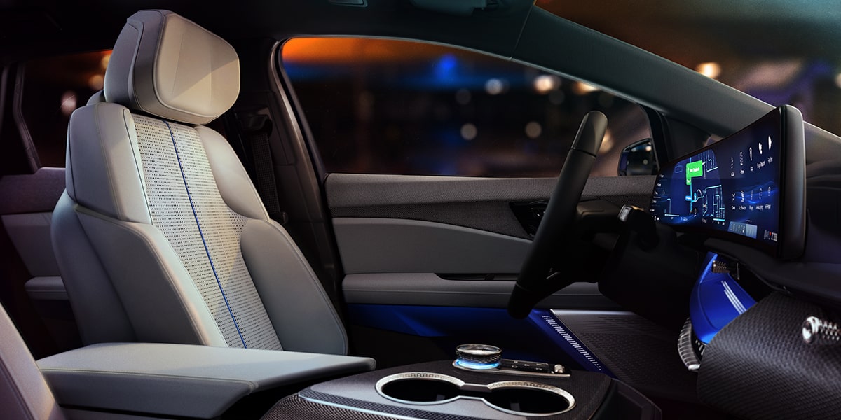 Passenger View of the 2027 Cadillac OPTIQ's Driver Side Seat and Dashboard
