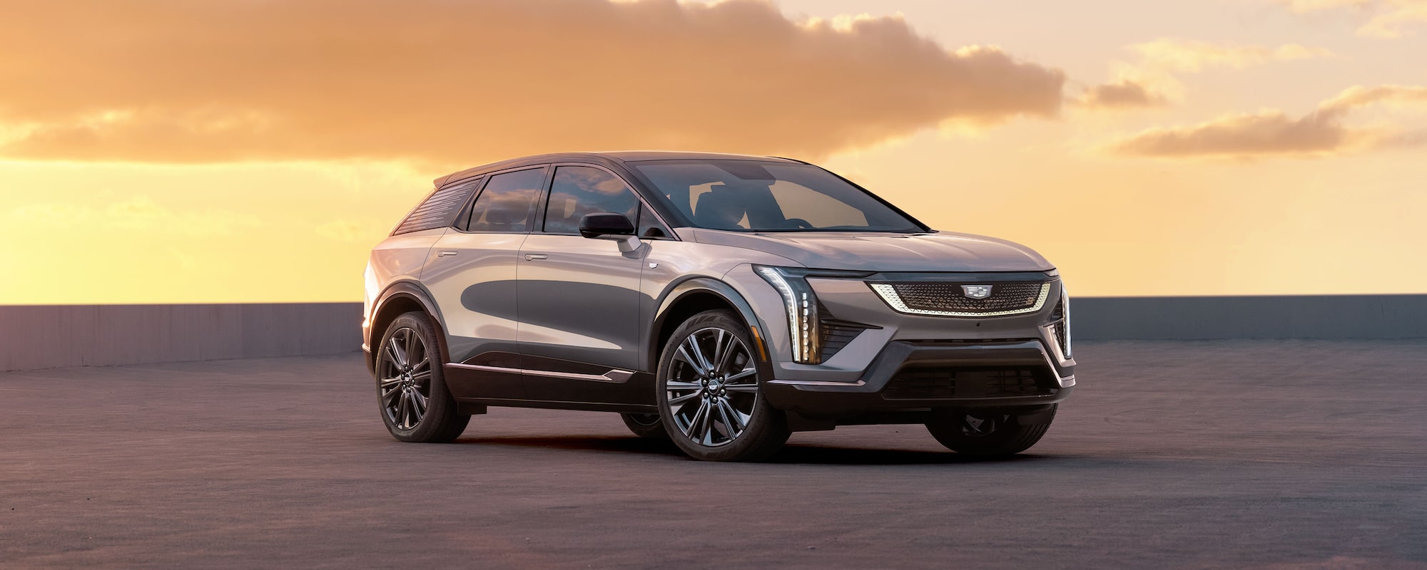 Three-quarter Passenger Side of the 2027 Cadillac OPTIQ During a Beautiful Sunrise
